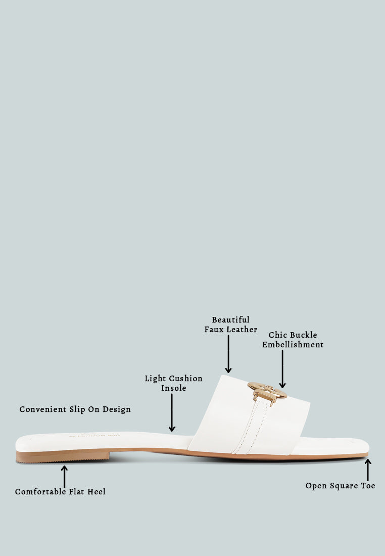 women metallic buckle embellished slip ons#color_off-white