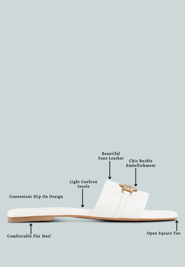 women metallic buckle embellished slip ons#color_off-white