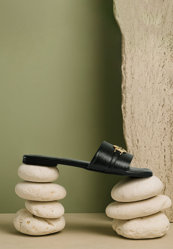 women metallic buckle embellished slip ons#color_black