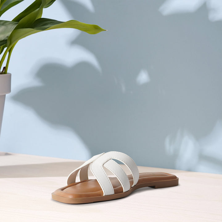 women faux leather flat heel slip ons#color_white