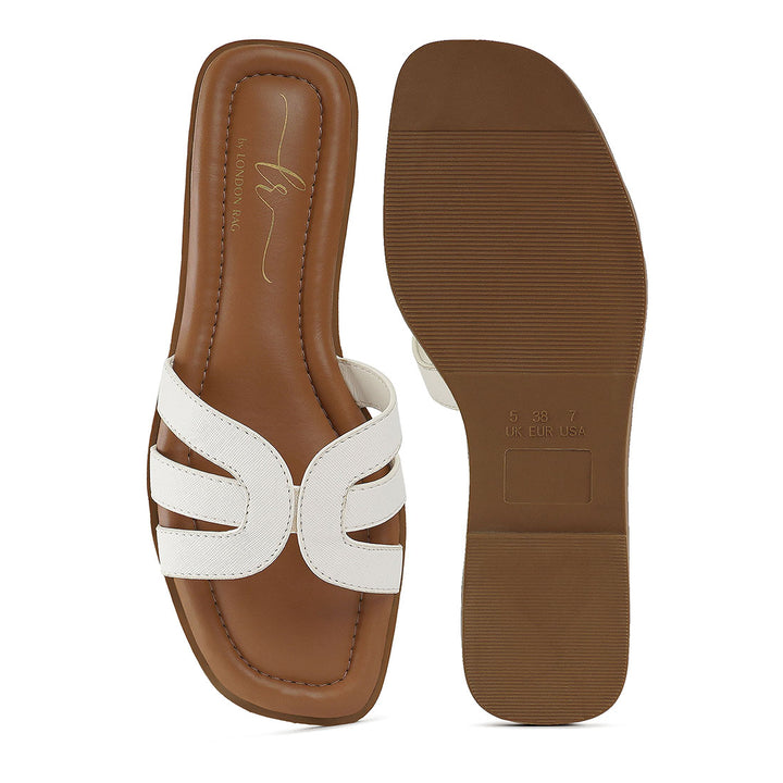 women faux leather flat heel slip ons#color_white