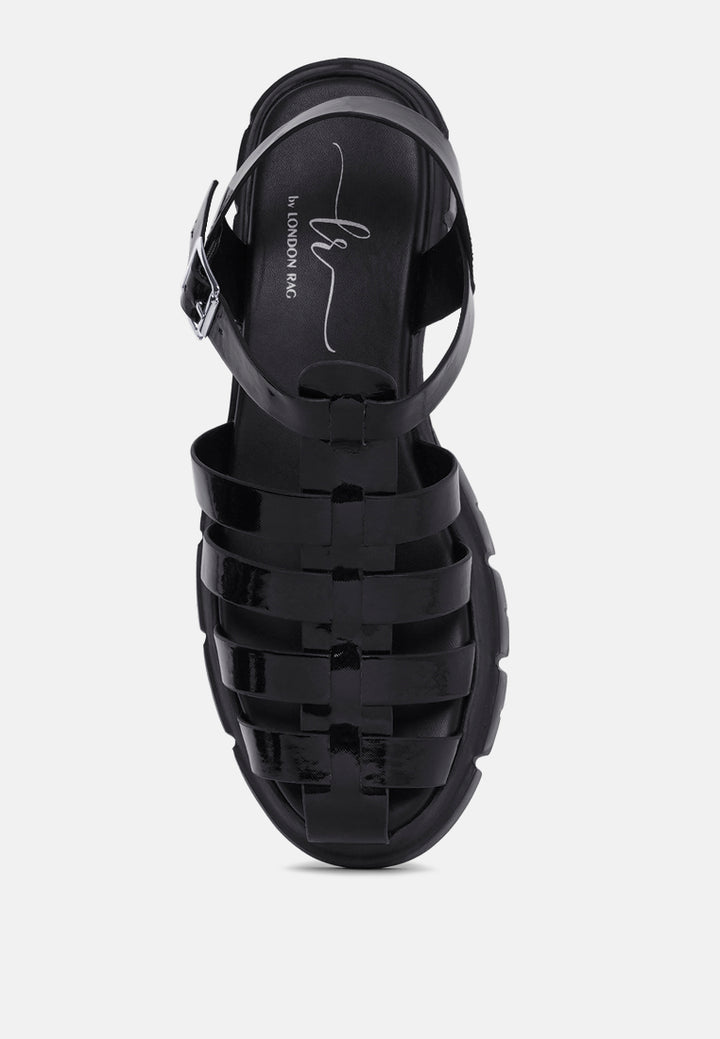 women round toe strappy flatforms#color_black