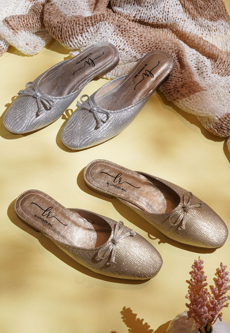 women bow detail metallic mules#color_gold
