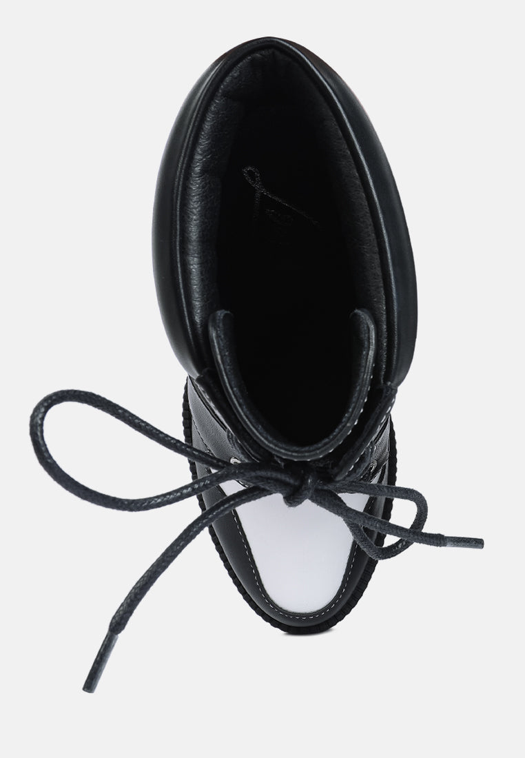 moos cow printed lace up block heel boots#color_black