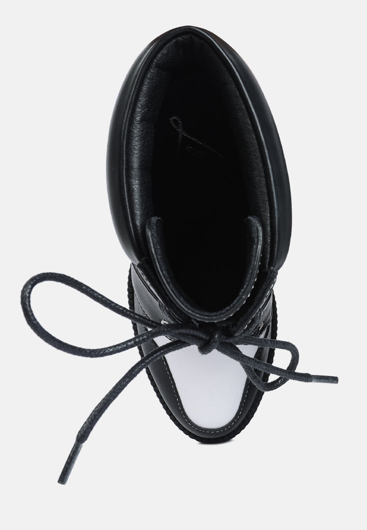 moos cow printed lace up block heel boots#color_black