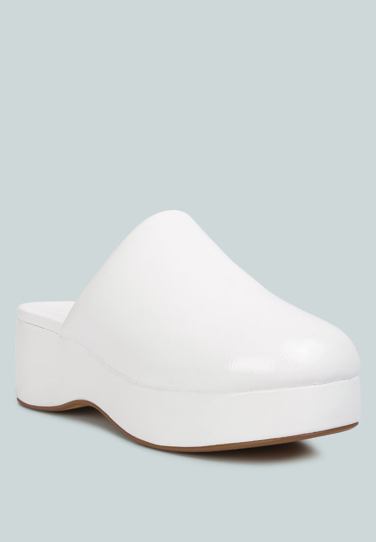 women olori solid platform slip on mules#color_white