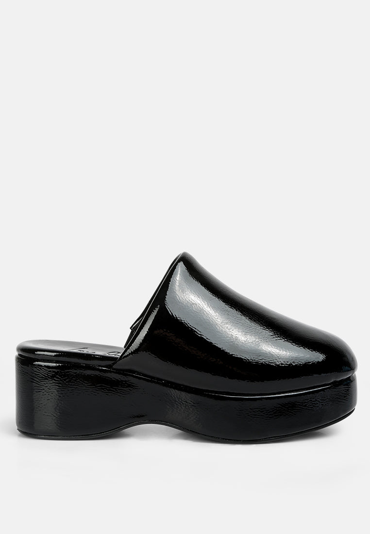 women olori solid platform slip on mules#color_black