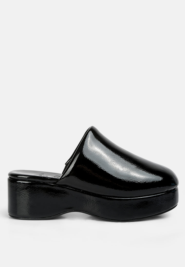 women olori solid platform slip on mules#color_black