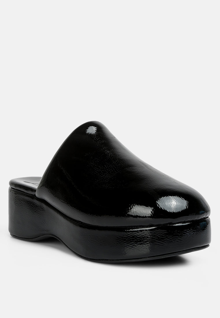 women olori solid platform slip on mules#color_black