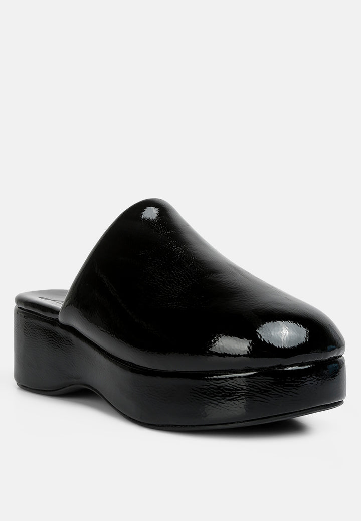 women olori solid platform slip on mules#color_black