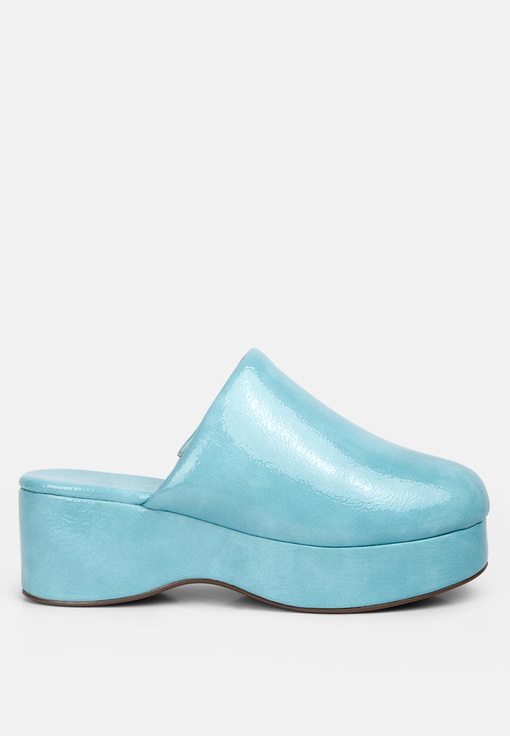 women olori solid platform slip on mules#color_blue