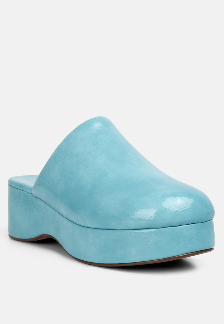 women olori solid platform slip on mules#color_blue